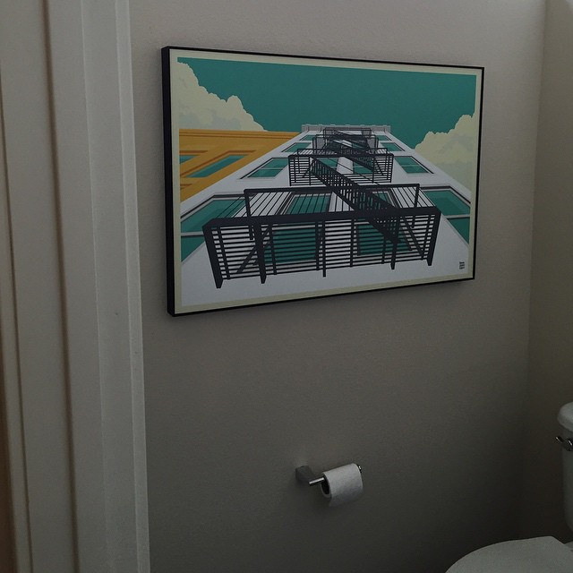 The downstairs bathroom finally has some art to look at while taking care of business.