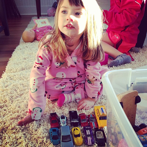 Caroline gets *two* dolls for Christmas and all she wants to do is play with her cars.
