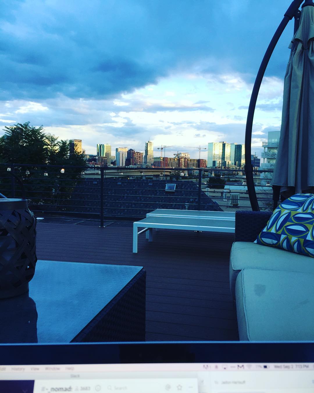 Catching up on some emails on the roof. #denver #denverskyline #colorado #autumniscoming