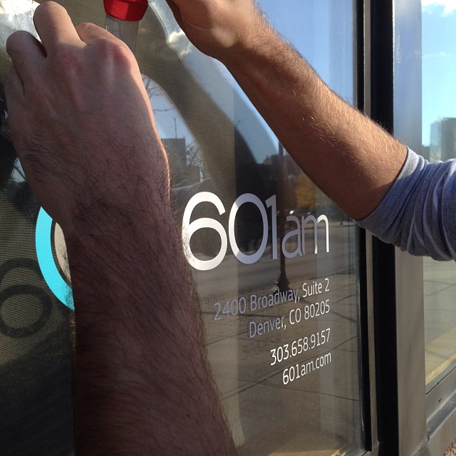 Taking down the sign from our first grown up office. Bittersweet.