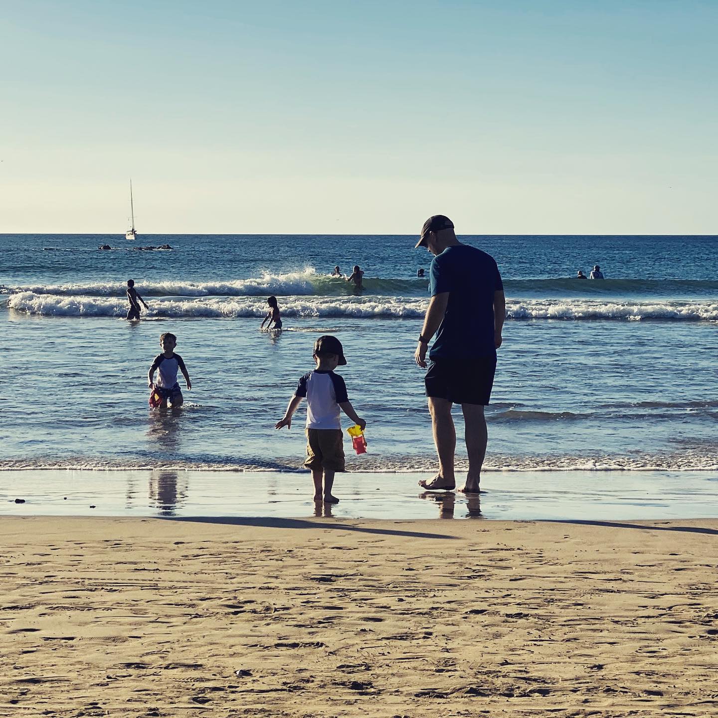 Looking for sea shells with Sam while Henry does whatever Henry does. 📷 by @sjfettig

#godsons #guncle