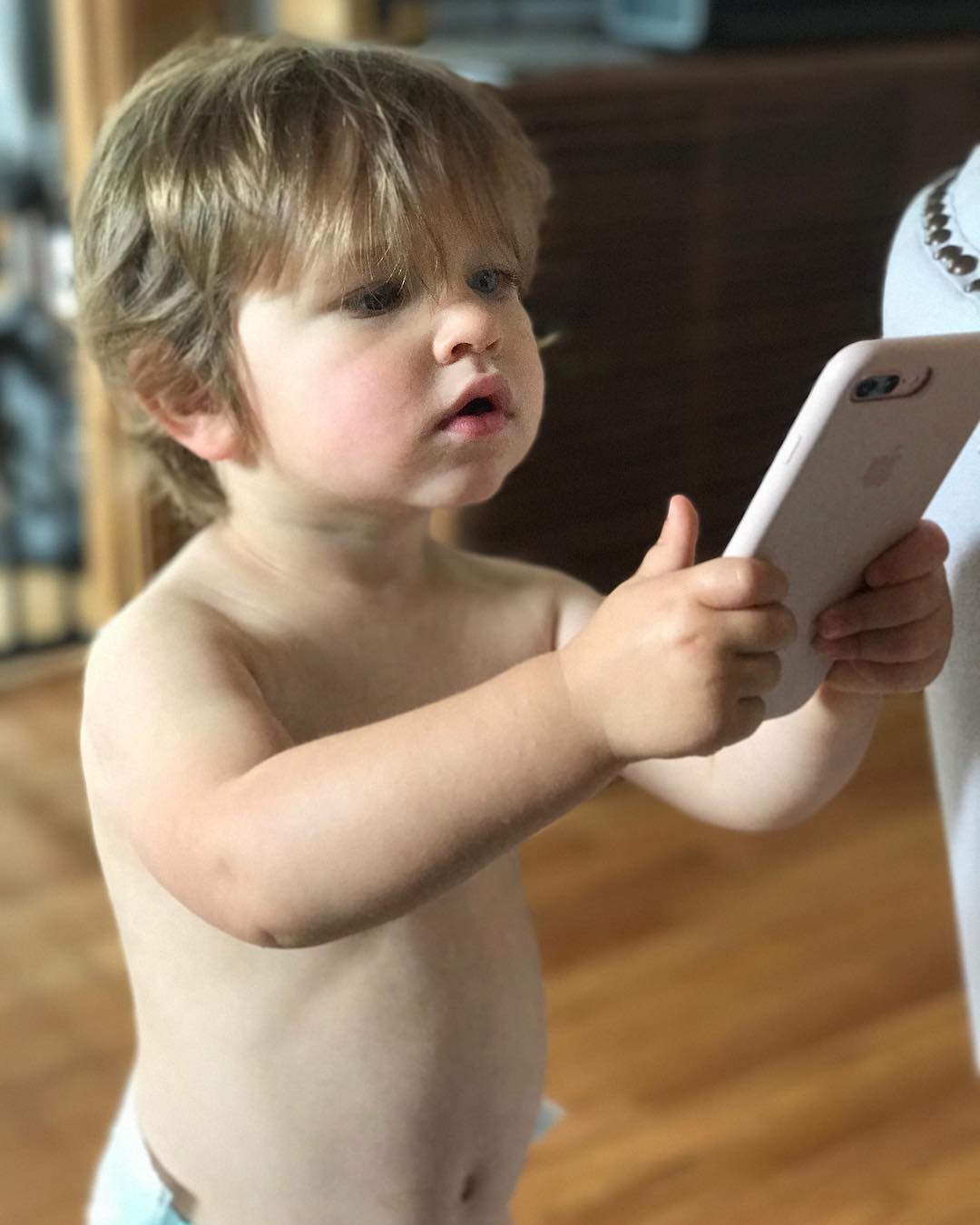 Henry trying to take a picture of me taking his picture. Love this kid!